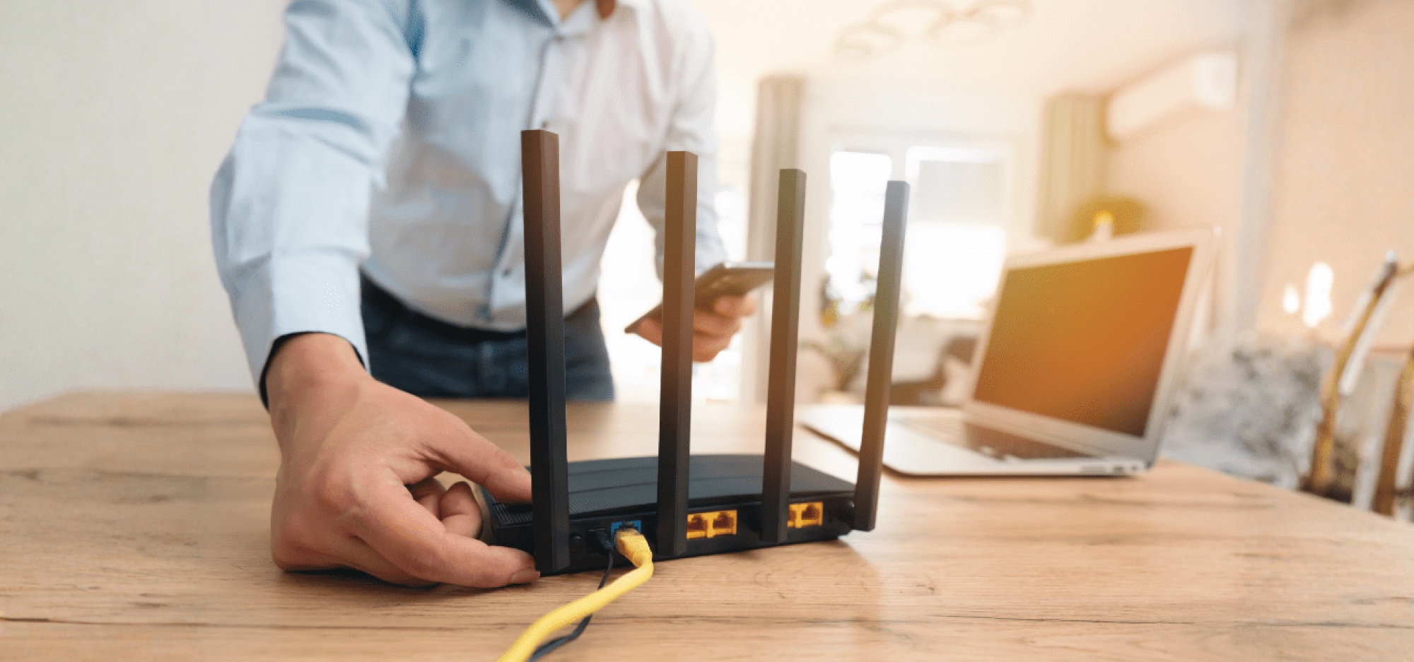 Technician setting up a commercial-grade router and network equipment