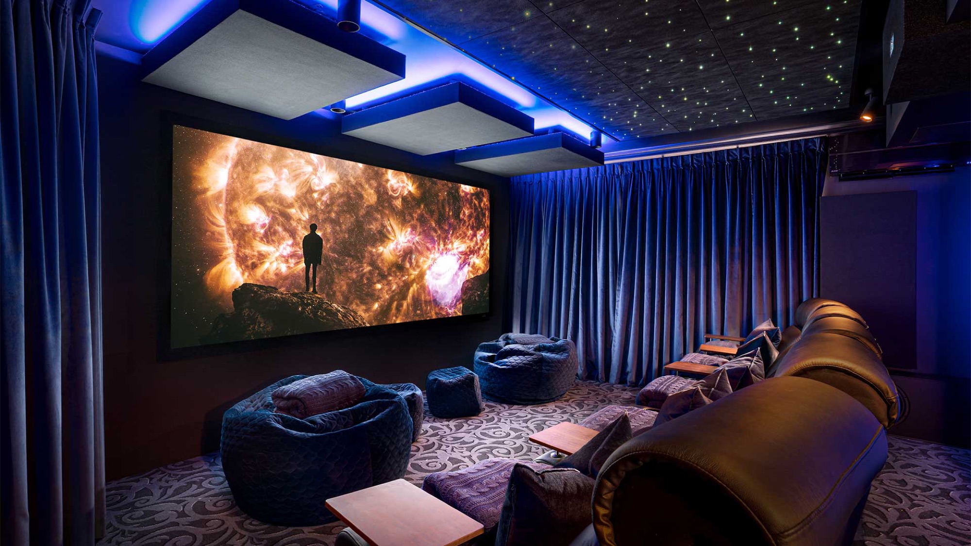 Luxury home theater with ambient lighting and lounge seating
